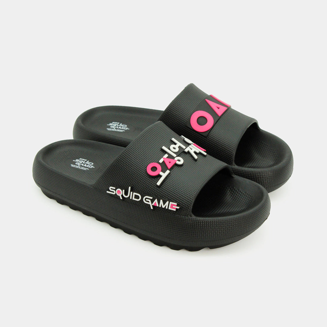 Par de sandalias negras tipo slide con iconos de círculo, triángulo y cuadrado en rosa neón.